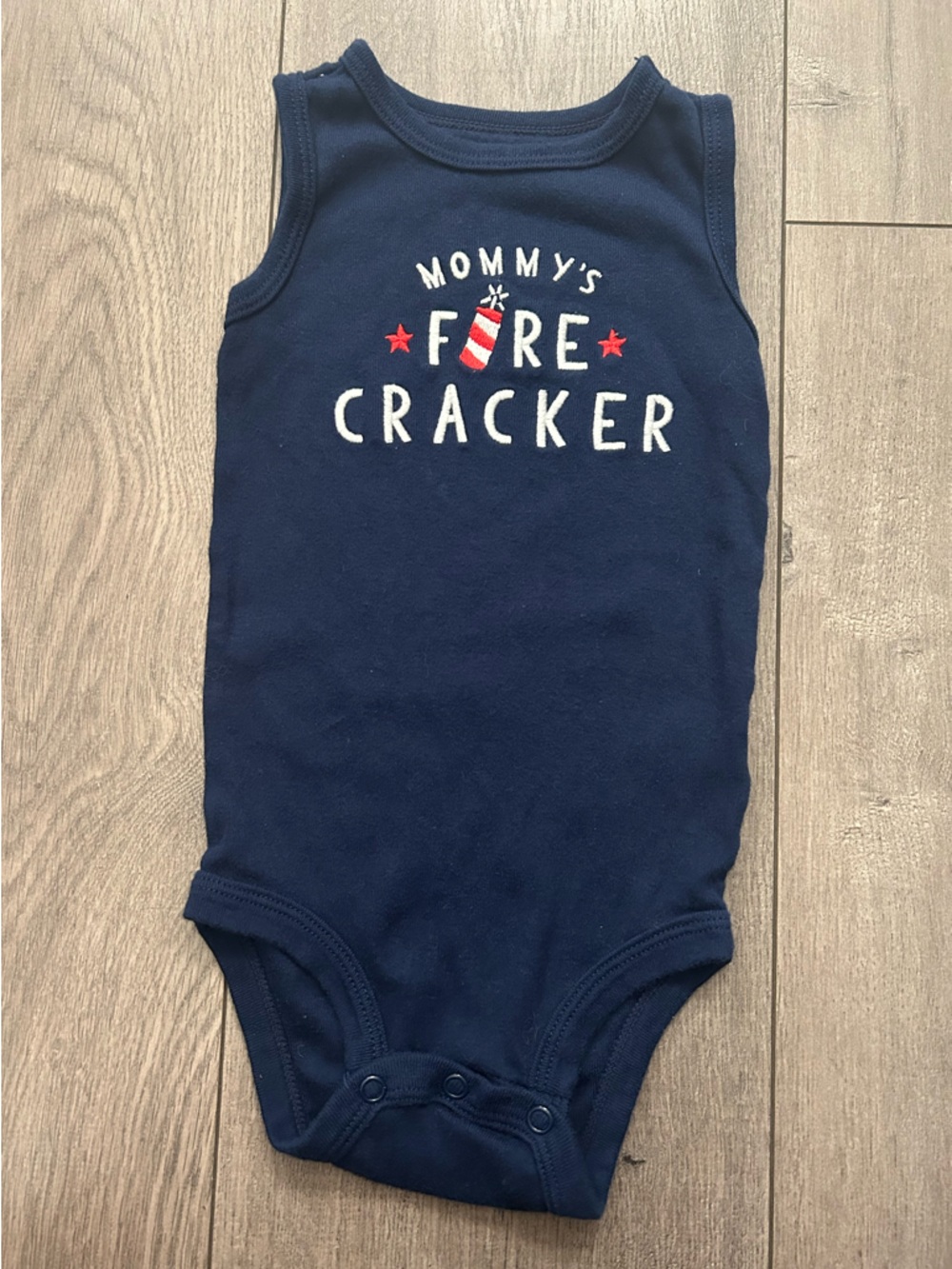 Navy blue infant onesie with a patriotic "Mommy's Firecracker" graphic - 12m